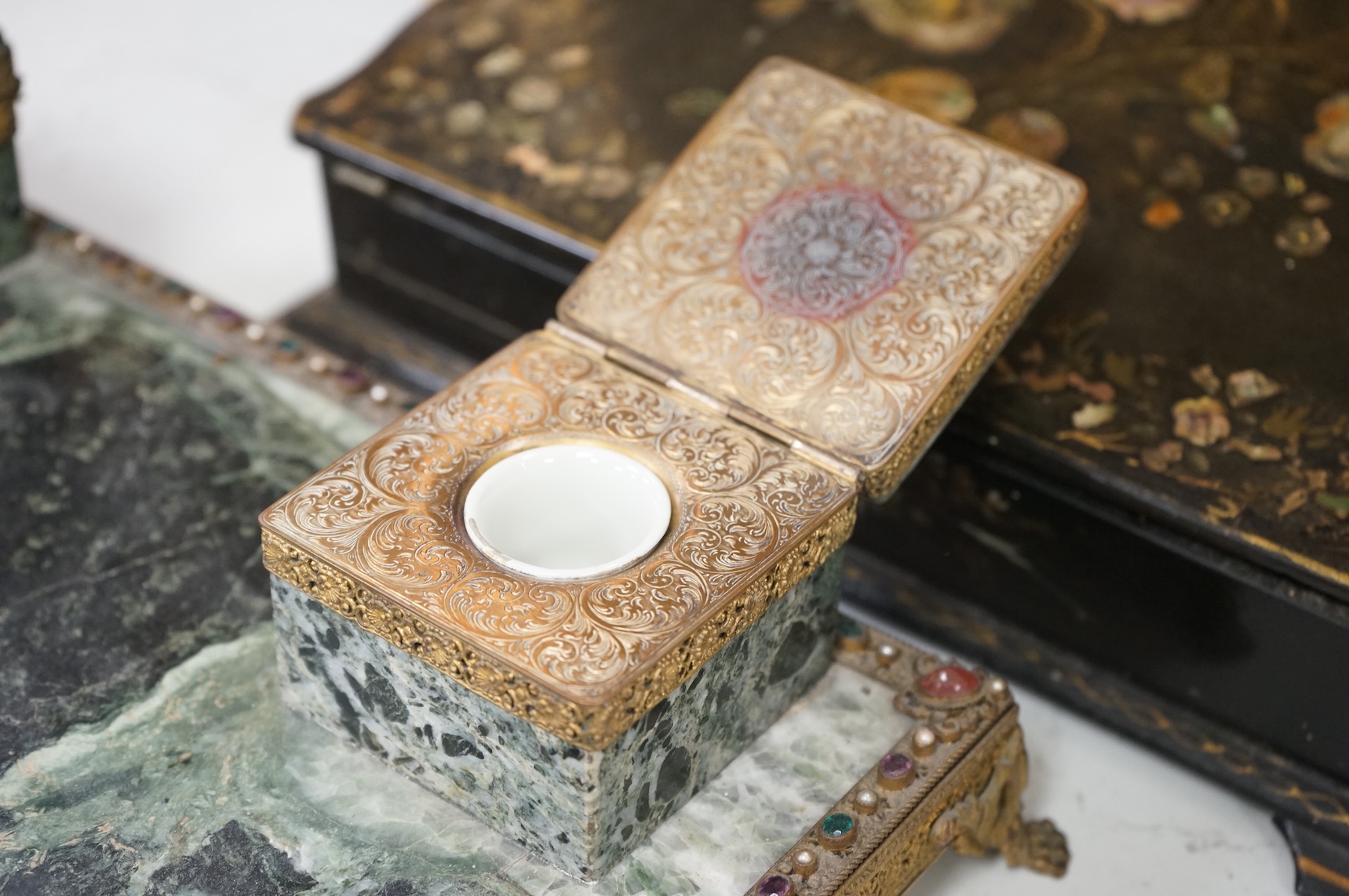 A Victorian papier maché mother of pearl inlaid writing slope and a 19th century French marble desk stand, 36cm wide